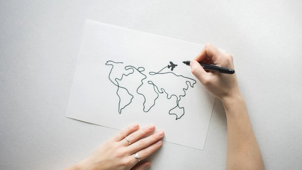 A paper map of Central Park pinned to a corkboard.