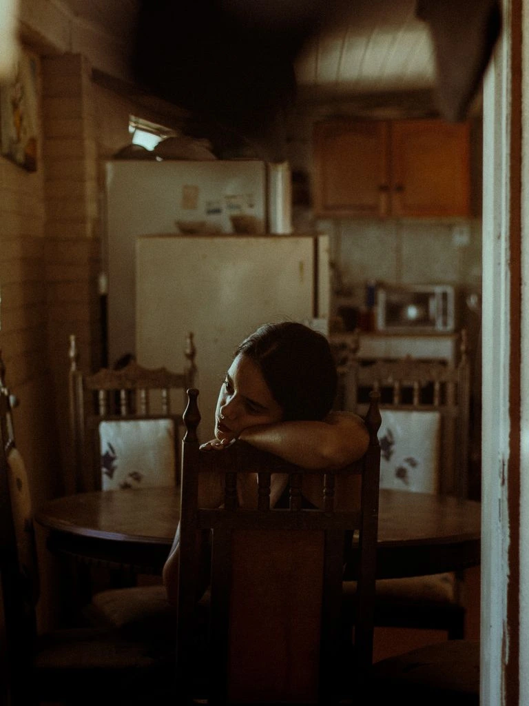 A quiet kitchen table on a Sunday morning with a folded newspaper and a cup of tea.