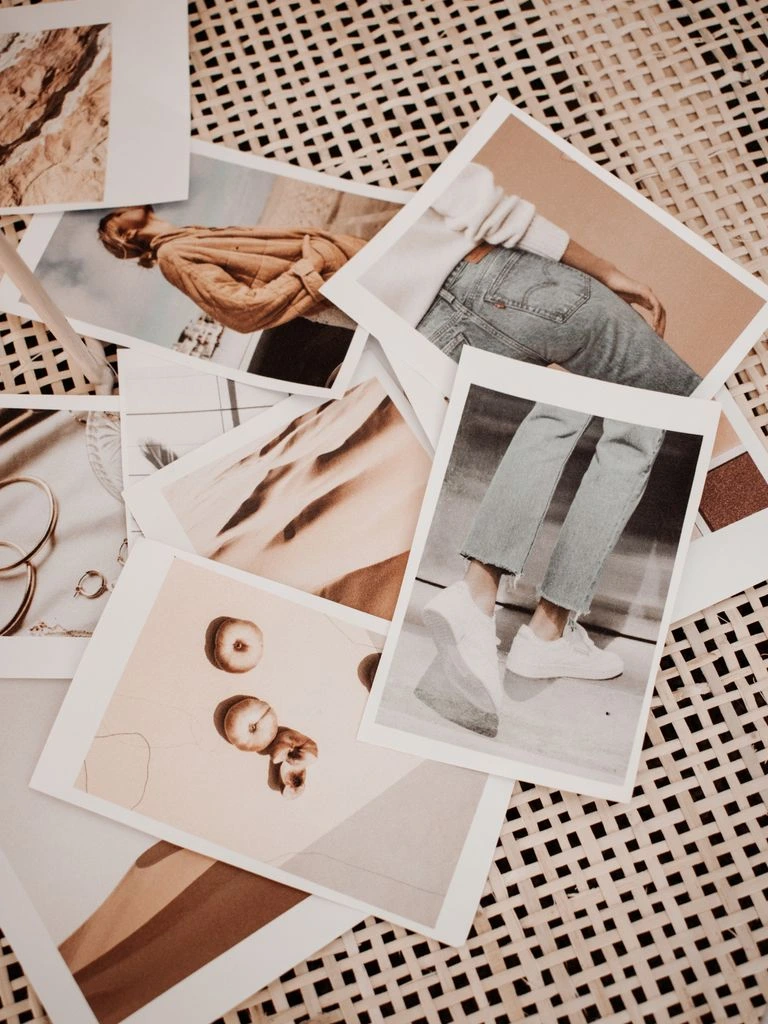 The Davinci Quarterly print zine open to a two-page spread on a cream linen surface.